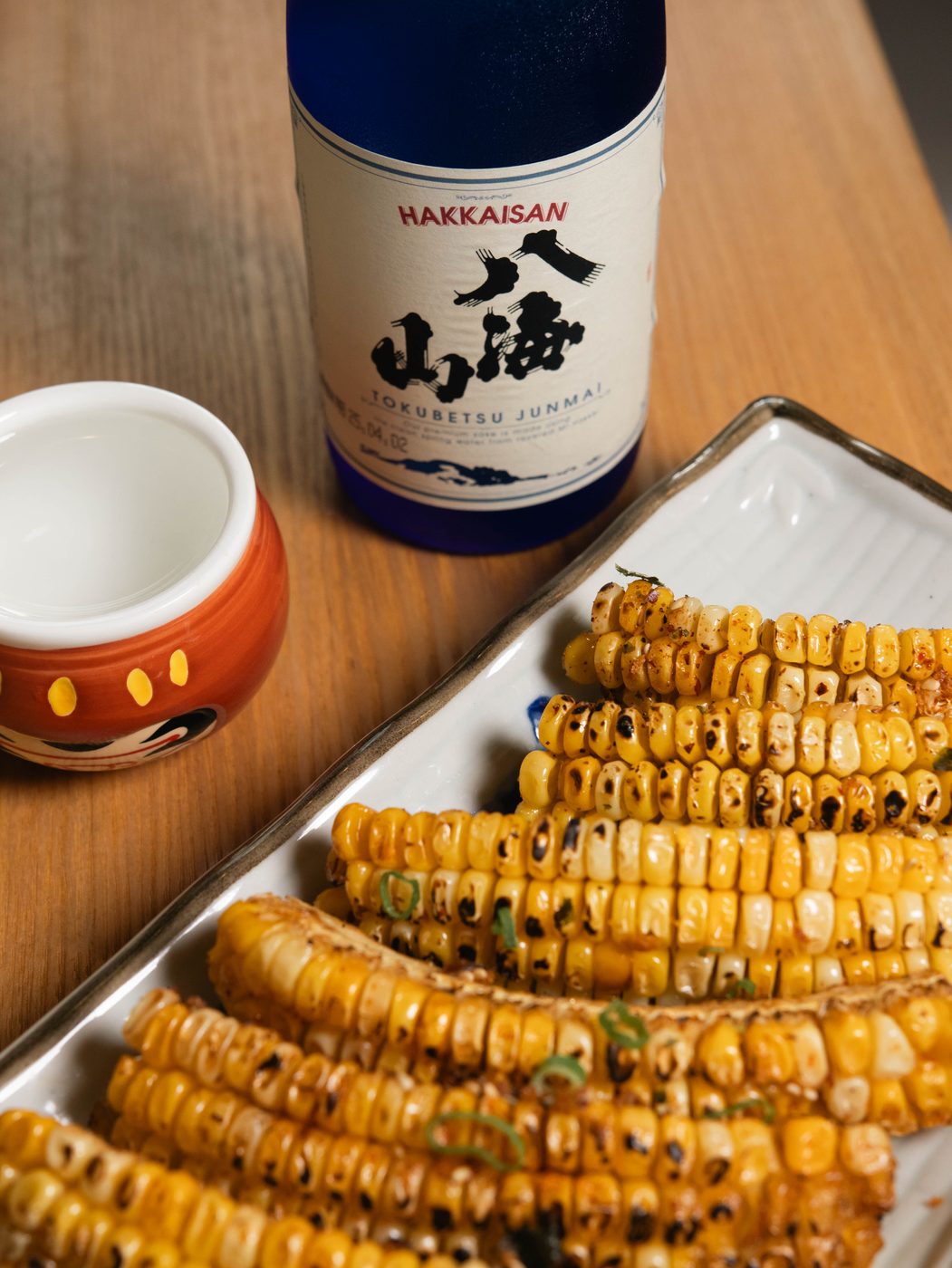 Grilled corn and sake menu photography for Ne Ne Neko